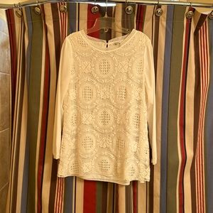 Dressy cream top with crochet overlay.